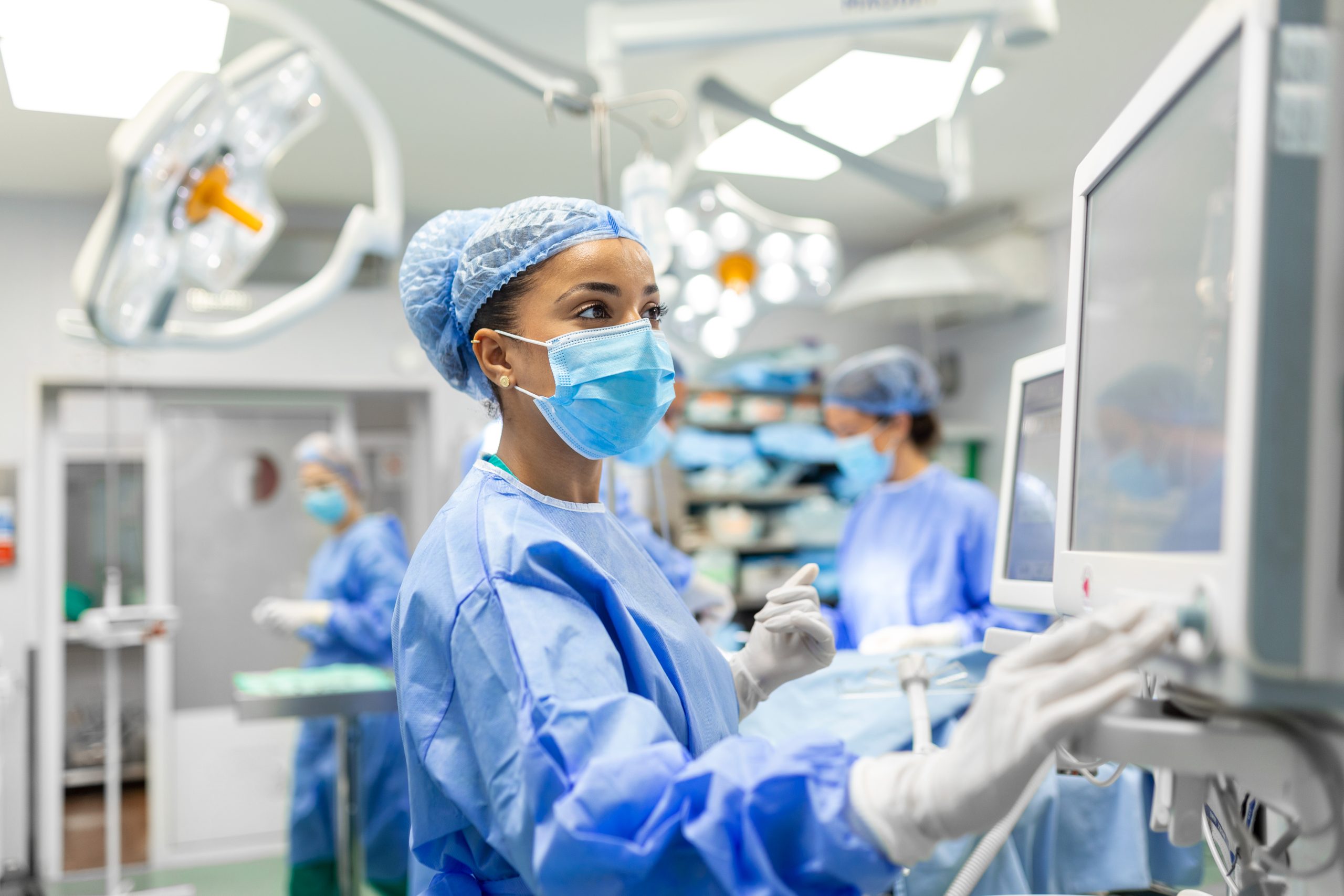 Anesthetist Working In Operating Theatre Wearing