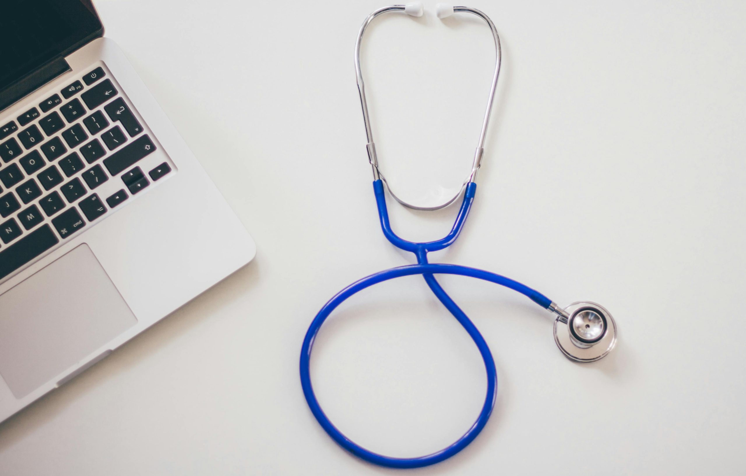 Doctors stethoscope and laptop