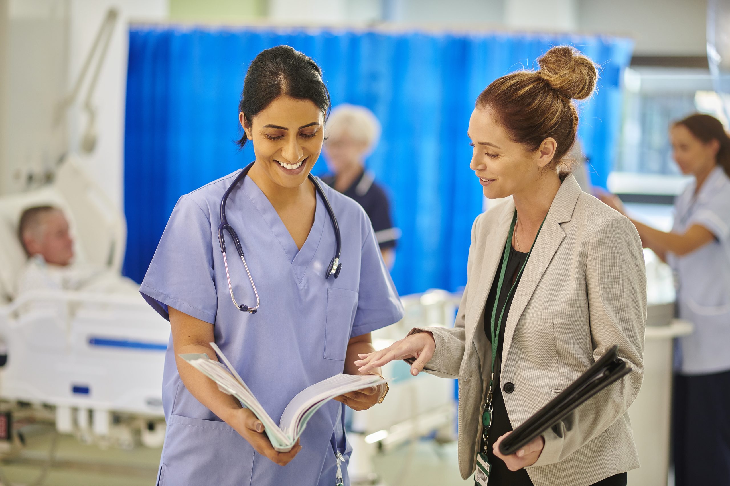 Female doctors reading medical notes