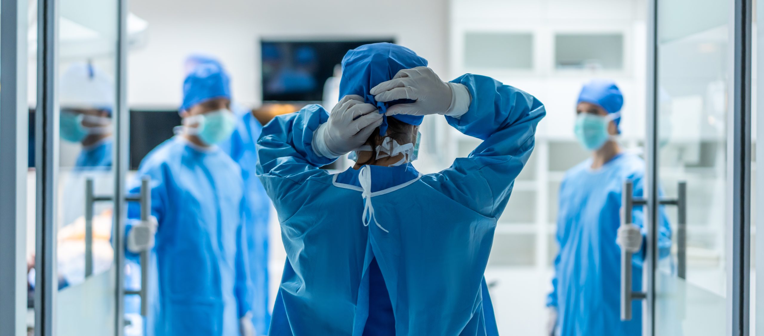 Surgical doctor entering operating theatre